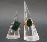 A yellow metal signet ring set with a blood stone,