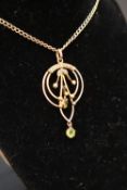 An Edwardian peridot and seed pearl pendant of concentric circle form to a yellow metal setting on