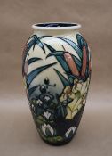 A Moorcroft pottery vase decorated in the "Lamia" pattern with bullrushes,