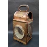 A Shand Mason & Co copper fire engine lamps of rectangular form with a leather covered oval folding