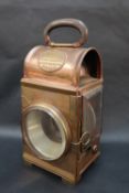 A Shand Mason & Co copper fire engine lamps of rectangular form with a leather covered oval folding