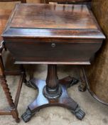 A Victorian rosewood teapoy the rectangular hinged top enclosing two lidded compartments and a