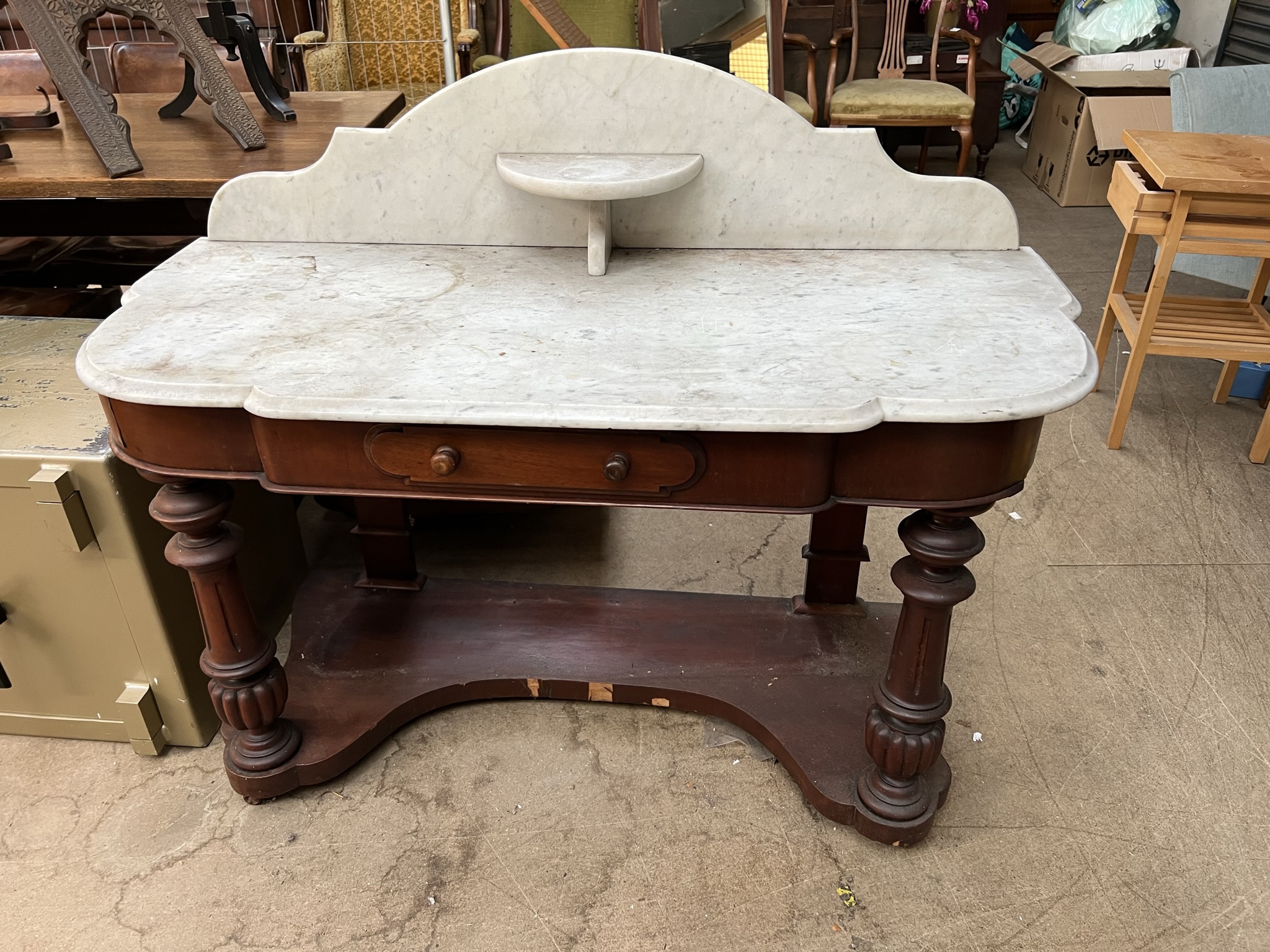 A Victorian mahogany marble topped duchess dressing table