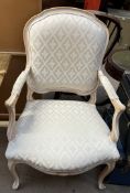 A continental upholstered elbow chair with a pad back,