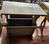 A 20th century oak magazine rack/ occasional table with a rectangular top above a vacant
