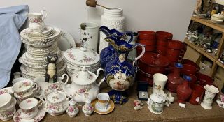 A Royal Albert Moss Rose pattern part tea and dinner service together with pottery jugs,