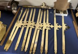 A collection of twelve brass stair rods and fittings