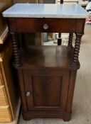 A Victorian mahogany bedside cabinet, with a rectangular marble top and bobbin turned upright,