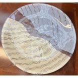 A Kosta Boda glass dish with blue and cream wave decoration,