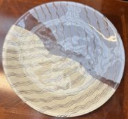 A Kosta Boda glass dish with blue and cream wave decoration,