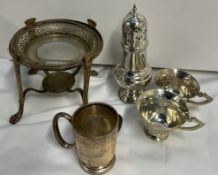 A silver christening mug together with an electroplated sugar caster,