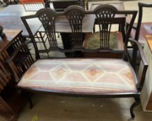 An Edwardian mahogany two seater settee, with a triple vase splat back,