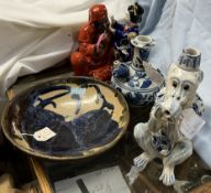 A Japanese pottery figure group together with a Chinese blue and white jug,