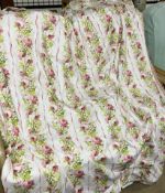 A pair of fringed cream, green and rose pattern curtains, pleated top 51" wide each,