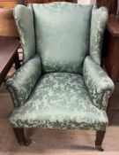 A 19th century mahogany wing back armchair,