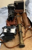 A brass and leather three drawer telescope together with cameras including Kodak,