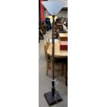 An Art Deco style standard lamp with a opaque glass shade and a chrome column on a square base