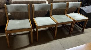 A set of four modern upholstered dining chairs