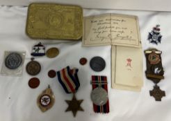 A Queen Mary tin together with two World War II medals,