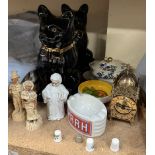 A pair of Staffordshire pottery cats together with pottery figures, brass clock,