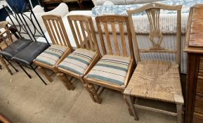 A pair of metal dining chairs together with a set of three dining chairs and another chair