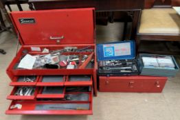A Snap-on tool station with a hinged lid, and drawers together with a Snap-on tool box,