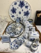 A blue and white pottery table top decorated with fruit and flowers together with a collection of