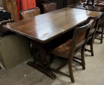 A 20th century oak refectory table together with a set of four oak dining chairs