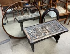 A mid 20th century circular mirror together with another mirror and a carved occasional table