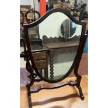 A 19th century style mahogany dressing table mirror of shield shape on splayed legs