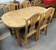 A 20th century pine dining table and four chairs