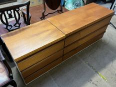 Two mid-20th century teak chests of drawers with cream sides