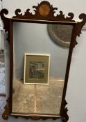 A George III style mahogany wall mirror with fan inlay,