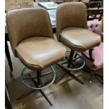 A pair of Kofabco faux leather and chrome bar stools