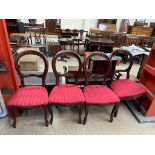 A set of four Victorian style balloon back dining chairs