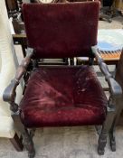 a 19th century elbow chair with a pad upholstered seat and back on turned legs and lions paw feet