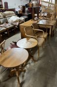 A modern drop leaf dining table together with a pair of bergere elbow chairs,