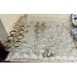 Gold rimmed wine glasses together with other wine glasses,