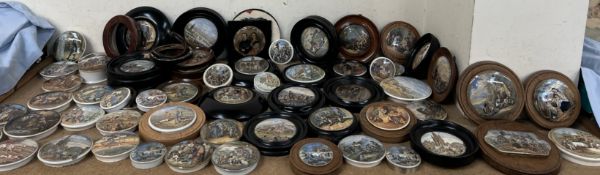 A large collection of 19th century pottery pot lids including various interior and exterior scenes