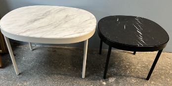 A white marble topped coffee table of oval form on cylindrical legs,