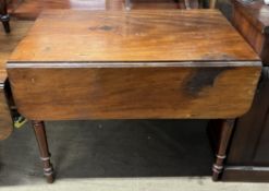 A large Victorian Pembroke table with drop flaps on turned legs