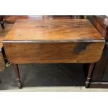 A large Victorian Pembroke table with drop flaps on turned legs