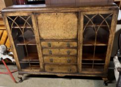 A 20th century walnut bureau bookcase with a rectangular top,