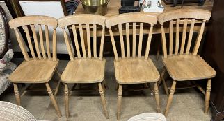 A set of four slat back kitchen chairs