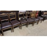 A set of six Edwardian dining chairs with pad upholstered seat on turned legs together with a