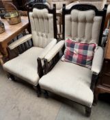 A pair of Edwardian mahogany library chairs with a carved back above a button upholstered back,