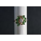 Gemporia - A 9ct gold Tsavorite garnet and white zircon ring,