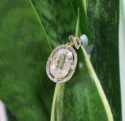 Gemporia - A 9ct gold kolum kunzite and diamond pendant, set with oval kunzite and round diamonds,