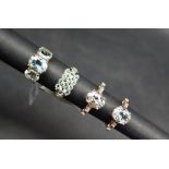 Gemporia - A 9ct gold aquamarine and white zircon ring, set with 3.