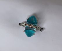 Gemporia - A 9ct white gold blue topaz, turquoise and diamond ring,